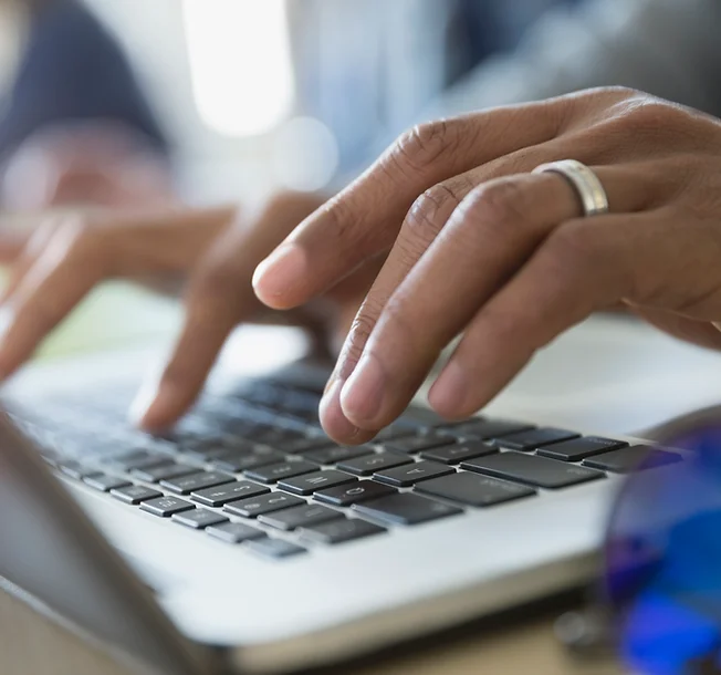 Person typing on a laptop